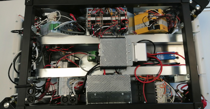 A circuit-breaker switch is present to disconnect the main power line going from the batteries to the rest of the robot. A quick-release connector is also present.
