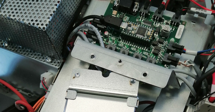 Under an RF cage we find a Teensy board for LED control and a third party speaker to play the sounds from the on-board controller.