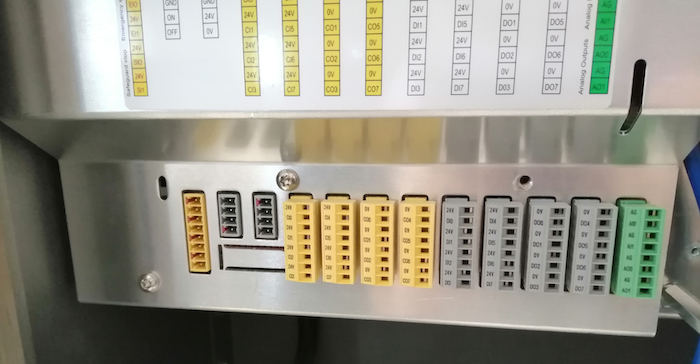 The safety side of the controller (documented in the user manuals) includes quick connectors which can be removed by carefully wiggling them out.