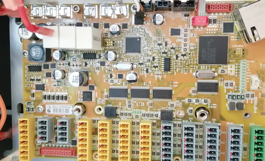F) After removing the metal shields, the safety board electronics are fully visible. The main logic is driven by an NXP LPC4437JET256 microcontroller unit (MCU).