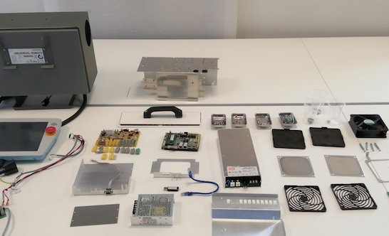 I) Final figure depicting all the components contained inside of the Universal Robots UR3 CB3.1 controller, leaving aside the teach pendant.
