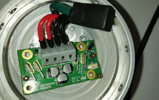 J) Opening the base joint of the manipulator we find the connections coming from the controller, the 48V leads and the micro-USB for data.