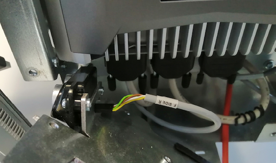 B) A circuit-breaker switch is present to disconnect the main power line going from the batteries to the rest of the robot. A quick-release connector is also present.